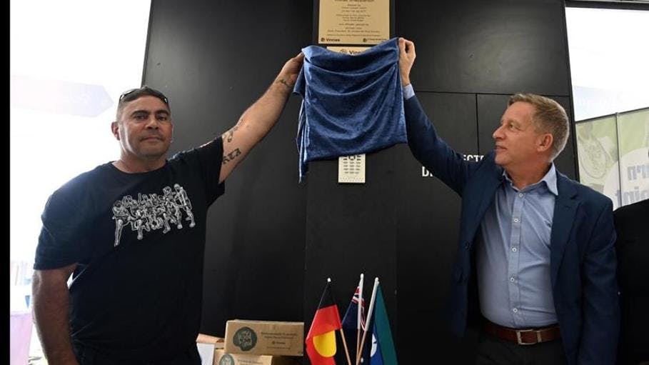 Corey Walker, a Traditional Owner of the lands of the Yorta Yorta people, and St Vincent de Paul Society Victoria CEO, Paul Turton launching the Acknowledgement of Country plaque at the Vinnies shop in Shepparton