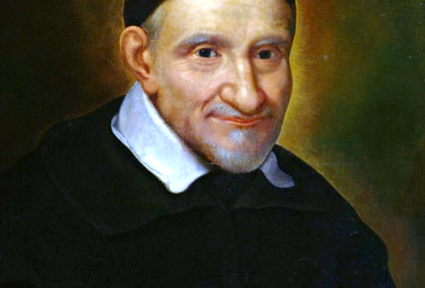 A photo of a painting of St Vincent de Paul in a dark robe, cap and a white collar. 