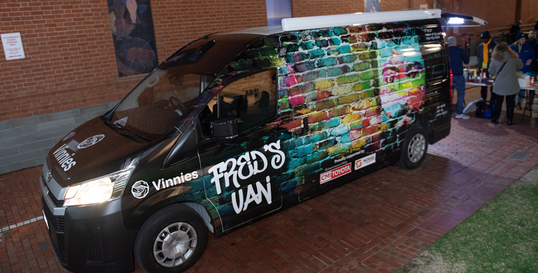 A picture of Fred's van, a Vinnie's food van with graffiti paint and Fred's Van written on it.