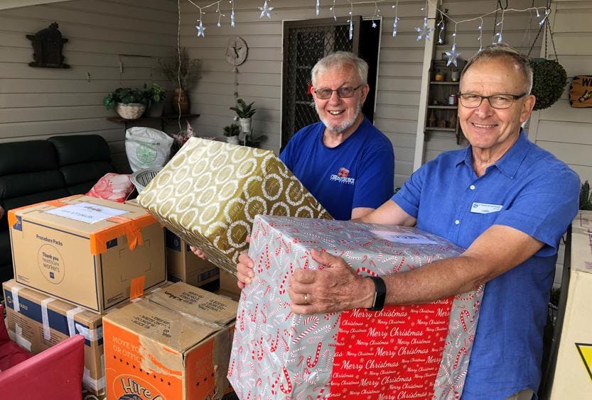 Members Larry Mann and Frank Ford with Christmas 2022 donations