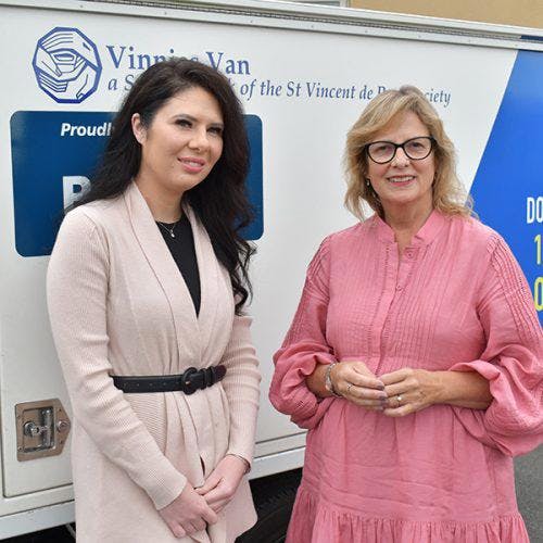 St Vincent de Paul Society (Tas) Community and Youth Manager, Samantha Grace with St Vincent de Paul Society (Tas) CEO, Heather Kent, beside one of the new food vans.